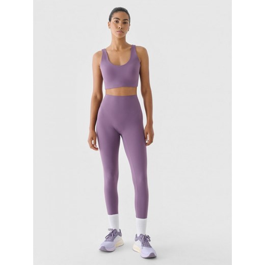 Damskie legginsy treningowe 4F 4FWAW24TFTIF317 - fioletowe ze sklepu Sportstylestory.com w kategorii Spodnie damskie - zdjęcie 176322382