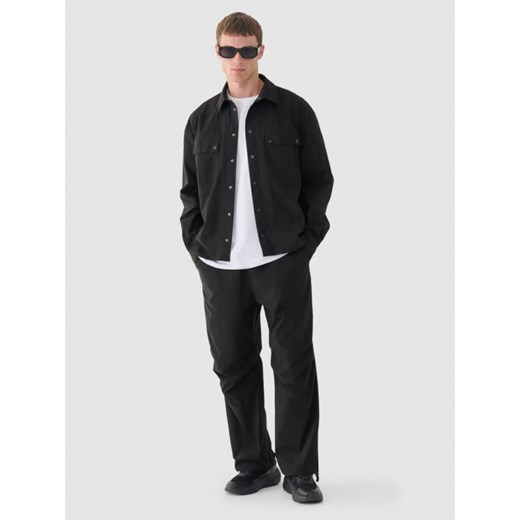 Męskie spodnie casual tkaninowe Outhorn OTHWAW24TTROM0894 - czarne ze sklepu Sportstylestory.com w kategorii Spodnie męskie - zdjęcie 176421483