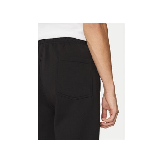 Champion Spodnie dresowe 220434 Czarny Loose Fit Champion XL MODIVO