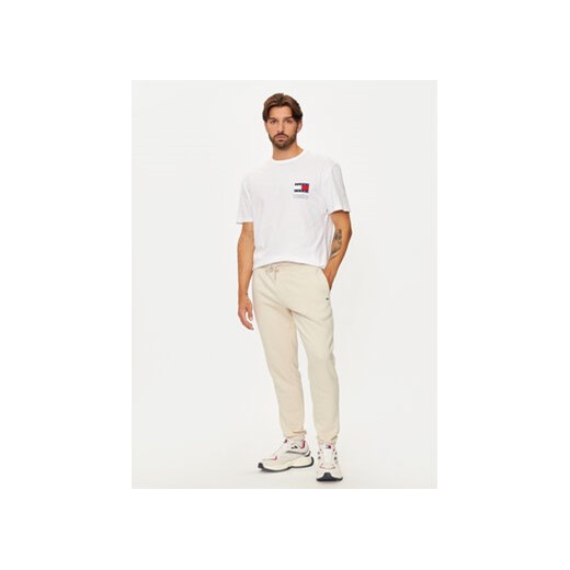 Tommy Jeans Spodnie dresowe Flag DM0DM20473 Beżowy Slim Fit Tommy Jeans M MODIVO