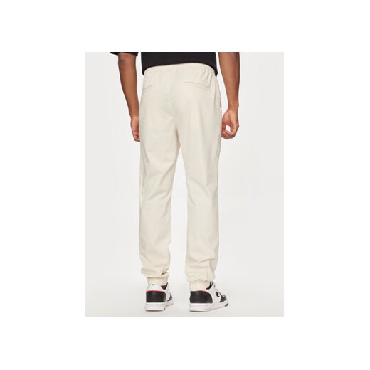 Champion Spodnie dresowe 219865 Beżowy Custom Fit Champion XXL MODIVO