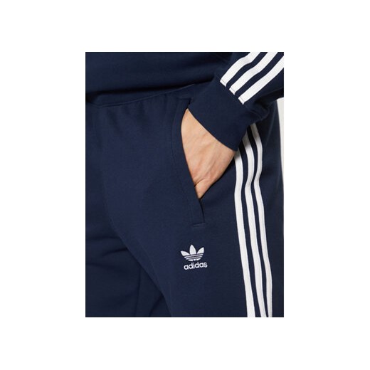 adidas Spodnie dresowe adicolor 3-Stripes IM9319 Granatowy Slim Fit M MODIVO