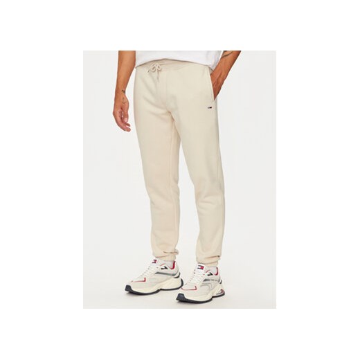 Tommy Jeans Spodnie dresowe Flag DM0DM20473 Beżowy Slim Fit Tommy Jeans M MODIVO