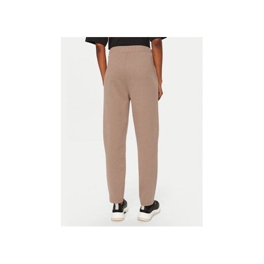 Calvin Klein Spodnie dresowe Satin K20K207945 Beżowy Slim Fit Calvin Klein XS MODIVO