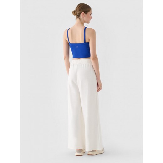 Damskie spodnie dresowe 4F 4FRSS24TTROF1331 - białe XL wyprzedaż Sportstylestory.com