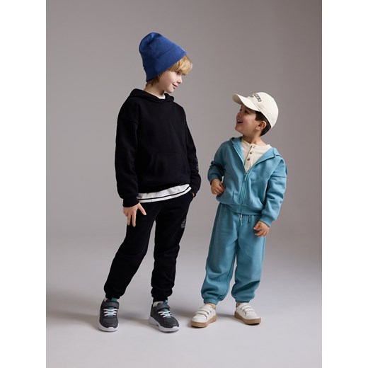 Reserved - Dresowe spodnie jogger - czarny Reserved 122 (6-7 lat) Reserved