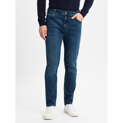 Tommy Hilfiger Dżinsy - Denton Stretch Mężczyźni Jeansy medium stone jednolity ze sklepu vangraaf w kategorii Jeansy męskie - zdjęcie 177790214