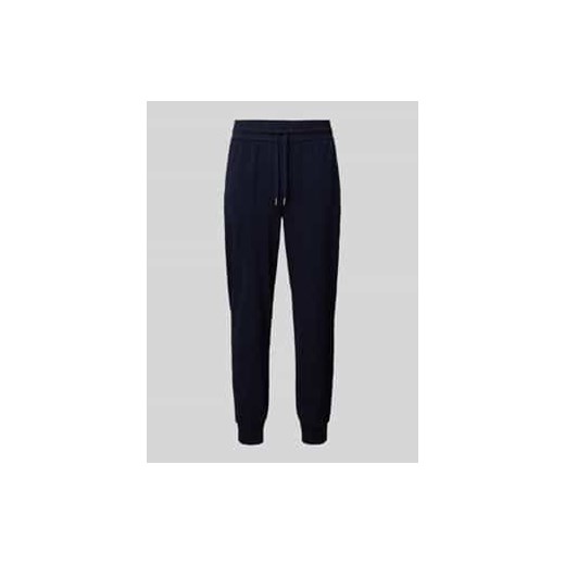 Spodnie typu track pants o kroju tapered fit z tunelem ze sklepu Peek&Cloppenburg  w kategorii Spodnie męskie - zdjęcie 177836901