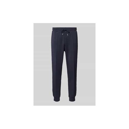 Spodnie dresowe o kroju slim fit z przeszytym kantem model ‘jack’ ze sklepu Peek&Cloppenburg  w kategorii Spodnie męskie - zdjęcie 177845550