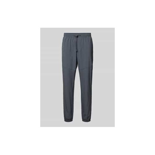 Spodnie treningowe o kroju relaxed fit z nadrukiem z logo model ‘Vibe’ ze sklepu Peek&Cloppenburg  w kategorii Spodnie męskie - zdjęcie 177849880