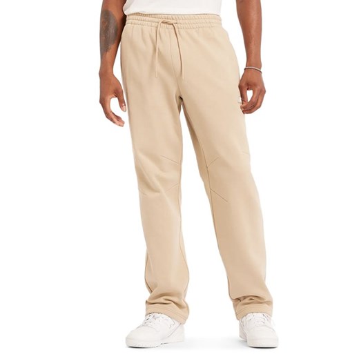 Spodnie New Balance MP44587SNW - beżowe ze sklepu streetstyle24.pl w kategorii Spodnie męskie - zdjęcie 177862502