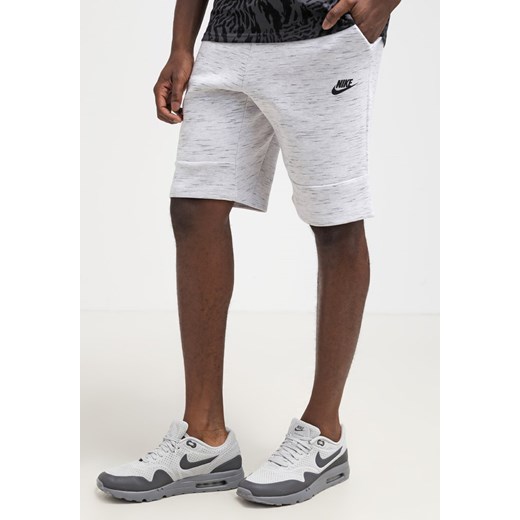 Nike Sportswear Spodnie treningowe birch/black/black zalando bialy Odzież