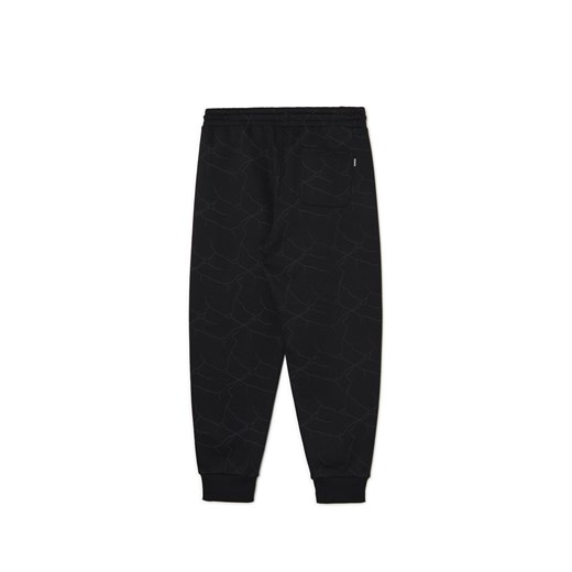 Cropp - Czarne dresowe joggery z nadrukiem all over - czarny Cropp S Cropp