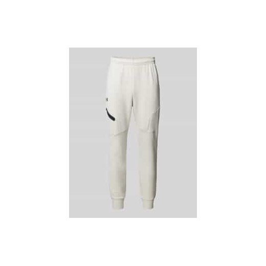 Spodnie dresowe o kroju relaxed fit z nadrukiem z logo model ‘Unstoppable’ ze sklepu Peek&Cloppenburg  w kategorii Spodnie męskie - zdjęcie 178197922