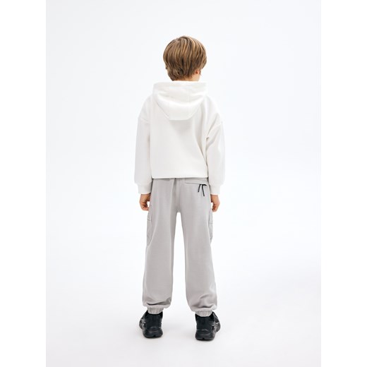 Spodnie chłopięce białe Reserved 
