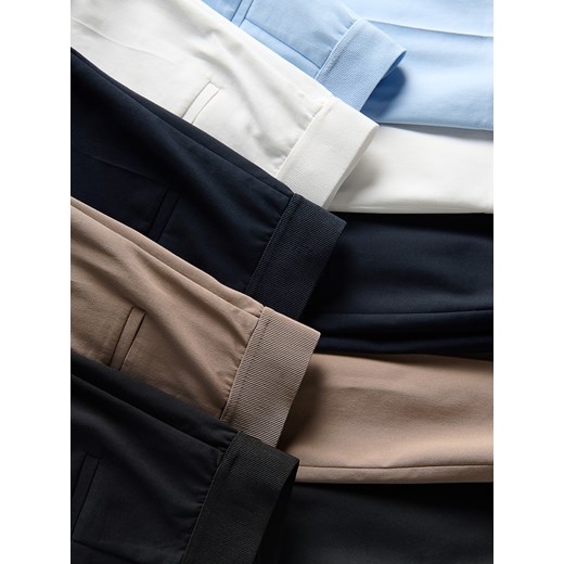 Reserved - Spodnie slim z kantem - granatowy Reserved 34 Reserved