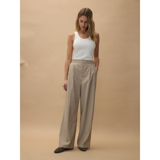 Spodnie damskie beżowe Reserved z tkaniny 