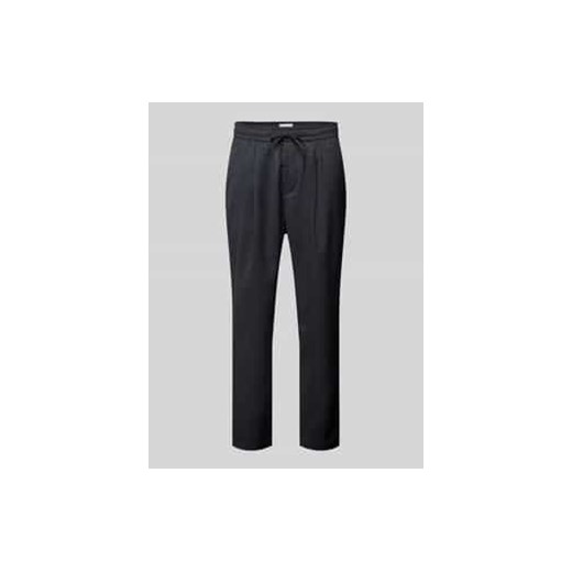 Spodnie materiałowe o kroju relaxed fit z tunelem ze sklepu Peek&Cloppenburg  w kategorii Spodnie męskie - zdjęcie 178338960