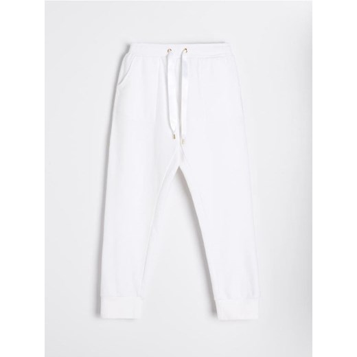 Sinsay - Casualowe spodnie dresowe z ozdobnym wiązaniem - kremowy Sinsay M Sinsay