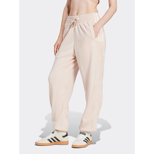 adidas Spodnie dresowe w kolorze jasnoróżowym ze sklepu Limango Polska w kategorii Spodnie damskie - zdjęcie 178424224