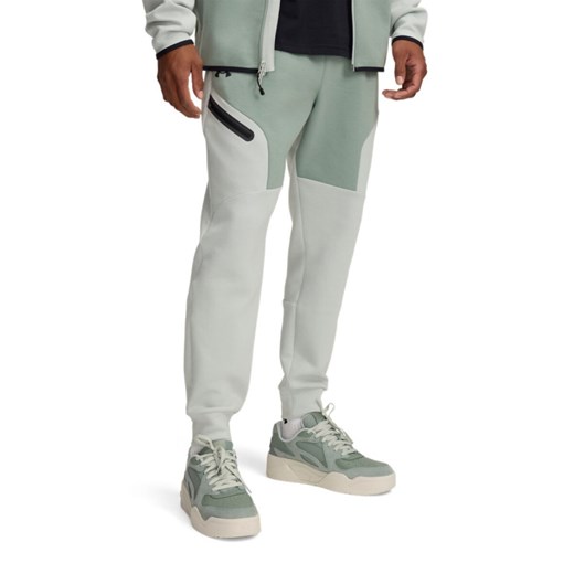 Męskie spodnie treningowe Under Armour UA Unstoppable Flc Jgr Eu - zielone ze sklepu Sportstylestory.com w kategorii Spodnie męskie - zdjęcie 178599070