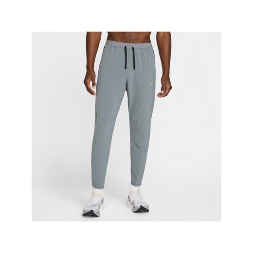 Męskie spodnie do biegania z tkaniny Dri-FIT Nike Stride - Szary ze sklepu Nike poland w kategorii Spodnie męskie - zdjęcie 178602472