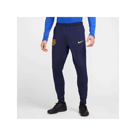 Męskie spodnie piłkarskie Nike Dri-FIT Inter Mediolan Strike (wersja trzecia) - Niebieski ze sklepu Nike poland w kategorii Spodnie męskie - zdjęcie 178603301