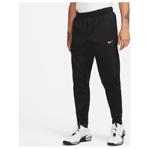 Męskie zwężane spodnie do fitnessu Therma-FIT Nike Therma - Czerń ze sklepu Nike poland w kategorii Spodnie męskie - zdjęcie 178607393