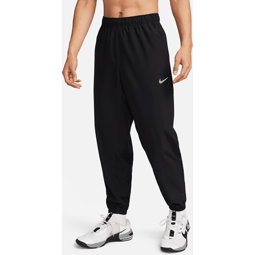 Męskie uniwersalne spodnie ze zwężanymi nogawkami Dri-FIT Nike Form - Czerń ze sklepu Nike poland w kategorii Spodnie męskie - zdjęcie 178608841