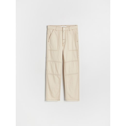 Reserved - Spodnie z kontrastowymi przeszyciami - złamana biel ze sklepu Reserved w kategorii Spodnie chłopięce - zdjęcie 178658620
