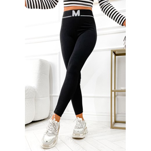 CZARNE LEGGINSY PRĄŻKOWANE Z OZDOBNĄ GUMĄ W PASIE ze sklepu olika.com.pl w kategorii Spodnie damskie - zdjęcie 178957544