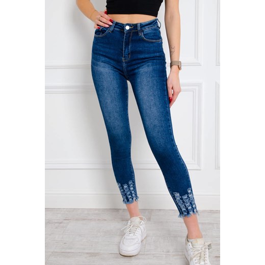 SPODNIE JEANSOWE SKINNY Z PRZETARCIAMI NA DOLE NOGAWKI ze sklepu olika.com.pl w kategorii Jeansy damskie - zdjęcie 178965911