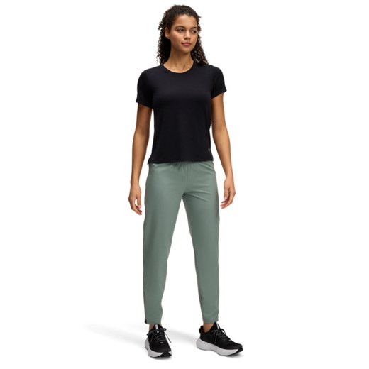 Damskie spodnie do biegania Under Armour UA OutRun the Storm Pants - zielone ze sklepu Sportstylestory.com w kategorii Spodnie damskie - zdjęcie 179003101