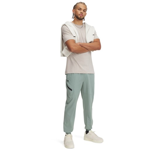 Męskie spodnie treningowe Under Armour UA Unstoppable Joggers - zielone ze sklepu Sportstylestory.com w kategorii Spodnie męskie - zdjęcie 179003130