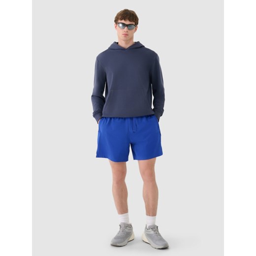 Męskie spodenki casual 4F 4FWSS25TSHOM533  - niebieskie ze sklepu Sportstylestory.com w kategorii Spodenki męskie - zdjęcie 179204154