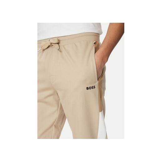 BOSS Spodnie dresowe Iconic 50535786 Beżowy Regular Fit M MODIVO