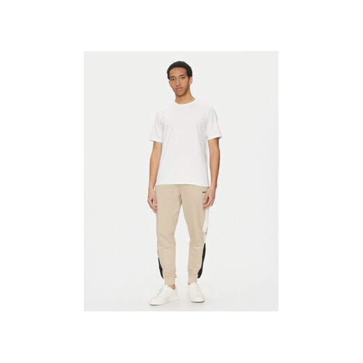 BOSS Spodnie dresowe Iconic 50535786 Beżowy Regular Fit M MODIVO