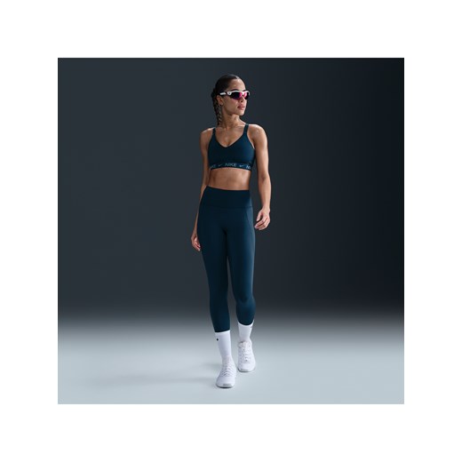 Damskie legginsy 7/8 z wysokim stanem i kieszeniami zapewniające średnie wsparcie Nike Universa - Niebieski ze sklepu Nike poland w kategorii Spodnie damskie - zdjęcie 179454053