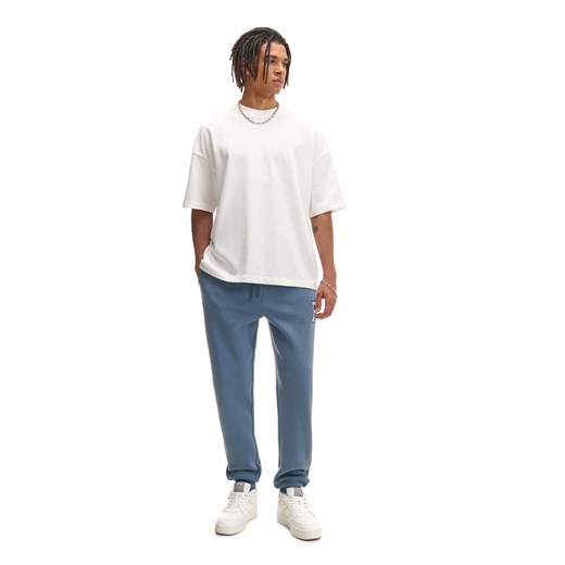 Cropp - Dresowe joggery regular z naszywką - surowy granatowy Cropp XL Cropp
