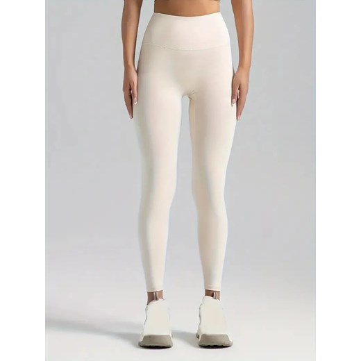 Legginsy sportowe damskie bezszwowe - Kremowy S ze sklepu Intimica.pl w kategorii Spodnie damskie - zdjęcie 179623321
