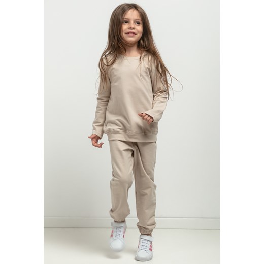 Prosta bluza ze stójką dla dziewczynki - jasnobeżowa ze sklepu Cudmoda w kategorii Bluzy dziewczęce - zdjęcie 179651972