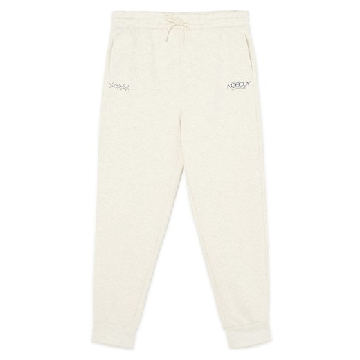 Cropp - Melanżowe kremowe spodnie z nadrukiem - kremowy Cropp XL Cropp