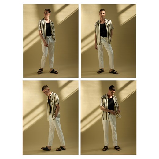 Reserved - Spodnie slim fit z paskiem - złamana biel ze sklepu Reserved w kategorii Spodnie męskie - zdjęcie 179828963