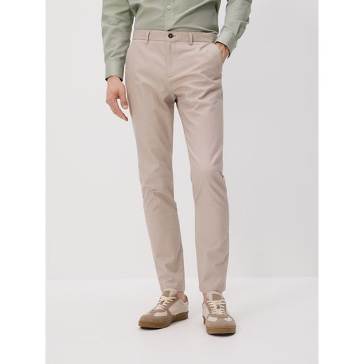 Reserved - Spodnie chino slim fit - beżowy ze sklepu Reserved w kategorii Spodnie męskie - zdjęcie 180362231