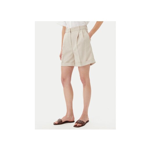 Tommy Hilfiger Szorty materiałowe WW0WW44767 Beżowy Regular Fit ze sklepu MODIVO w kategorii Szorty - zdjęcie 180403461