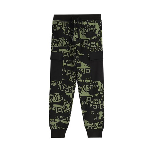 Coccodrillo Spodnie dresowe WC5120101GBJ Czarny Slim Fit ze sklepu MODIVO w kategorii Spodnie chłopięce - zdjęcie 181057574