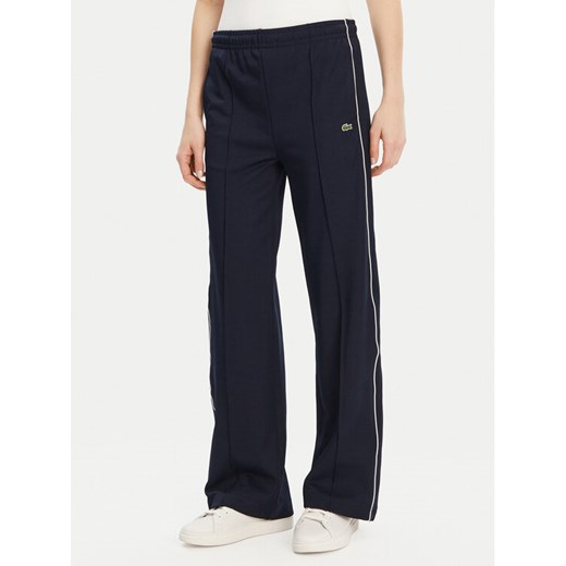 Lacoste Spodnie dresowe XF7260 Granatowy Relaxed Fit ze sklepu MODIVO w kategorii Spodnie damskie - zdjęcie 181115510