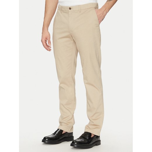 Tommy Hilfiger Chinosy Denton MW0MW37717 Beżowy Slim Fit ze sklepu MODIVO w kategorii Spodnie męskie - zdjęcie 181139970