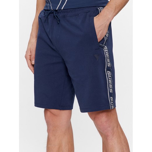 Guess Szorty materiałowe Arlo Z2YD02 K6ZS1 Granatowy Loose Fit ze sklepu MODIVO w kategorii Spodenki męskie - zdjęcie 181152102