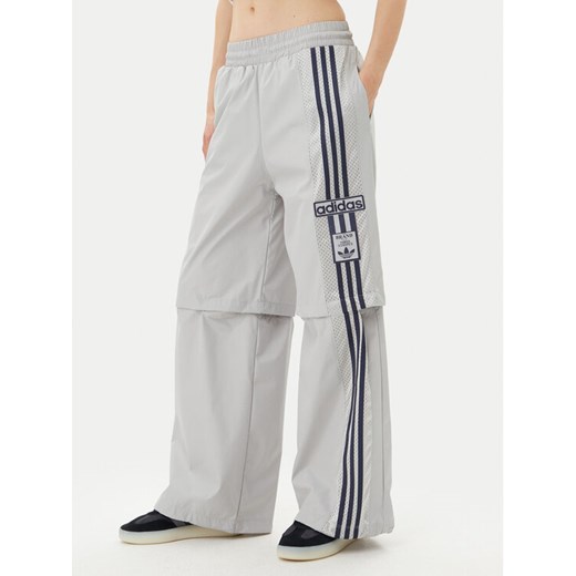 adidas Spodnie dresowe Adibreak JJ3122 Szary Regular Fit ze sklepu MODIVO w kategorii Spodnie damskie - zdjęcie 181887340